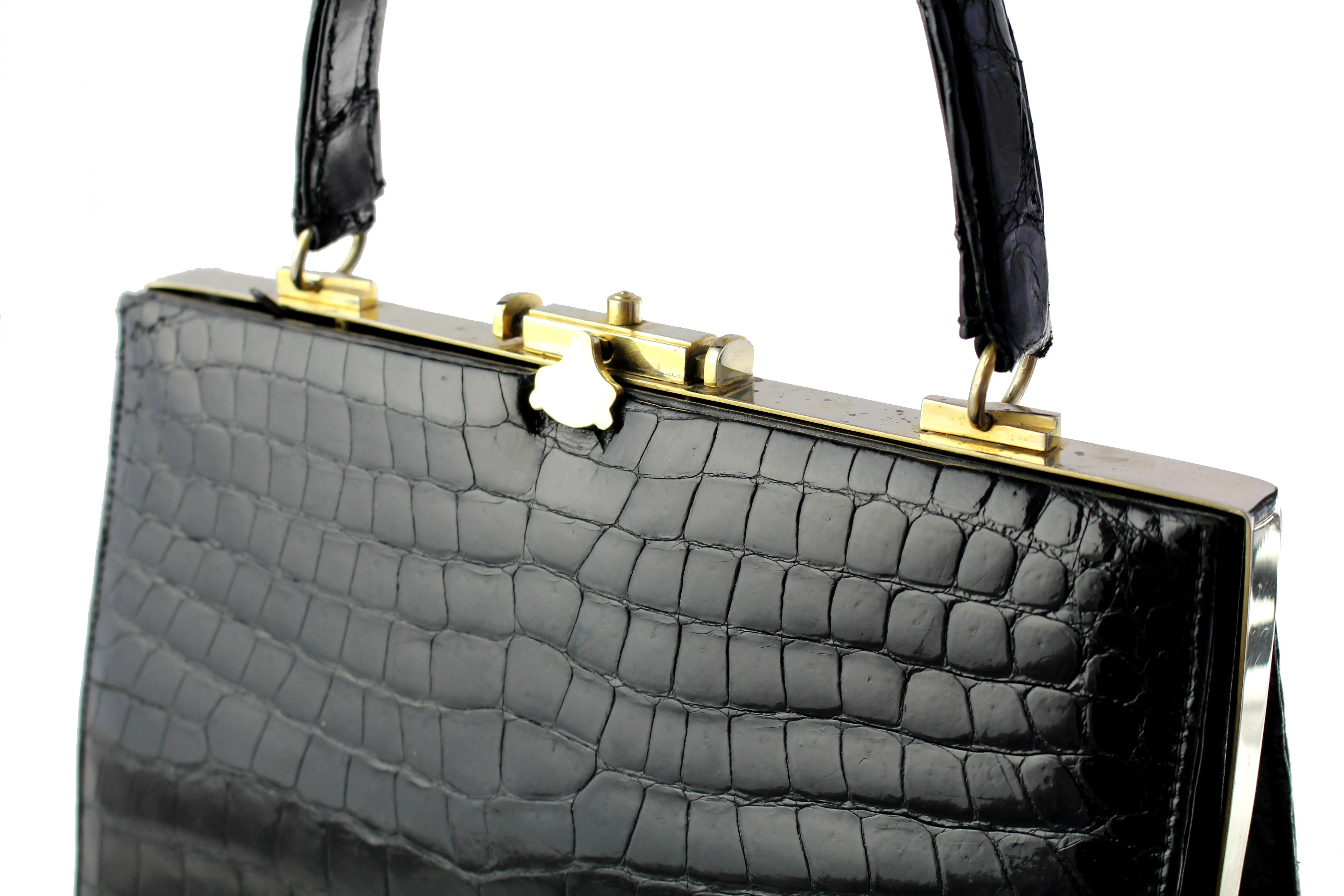 Black crocodile skin handbag with metallic frame