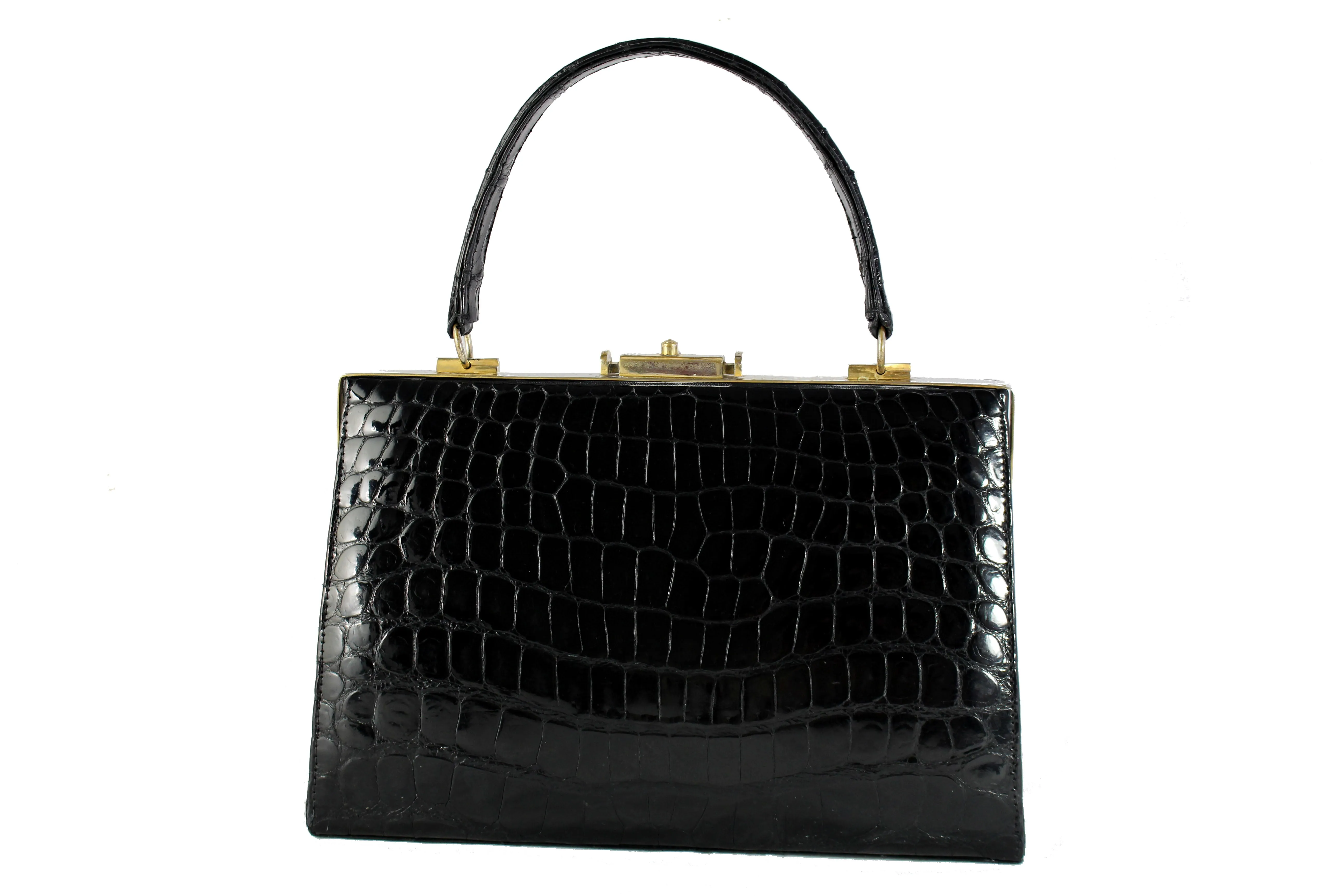 Black crocodile skin handbag with metallic frame